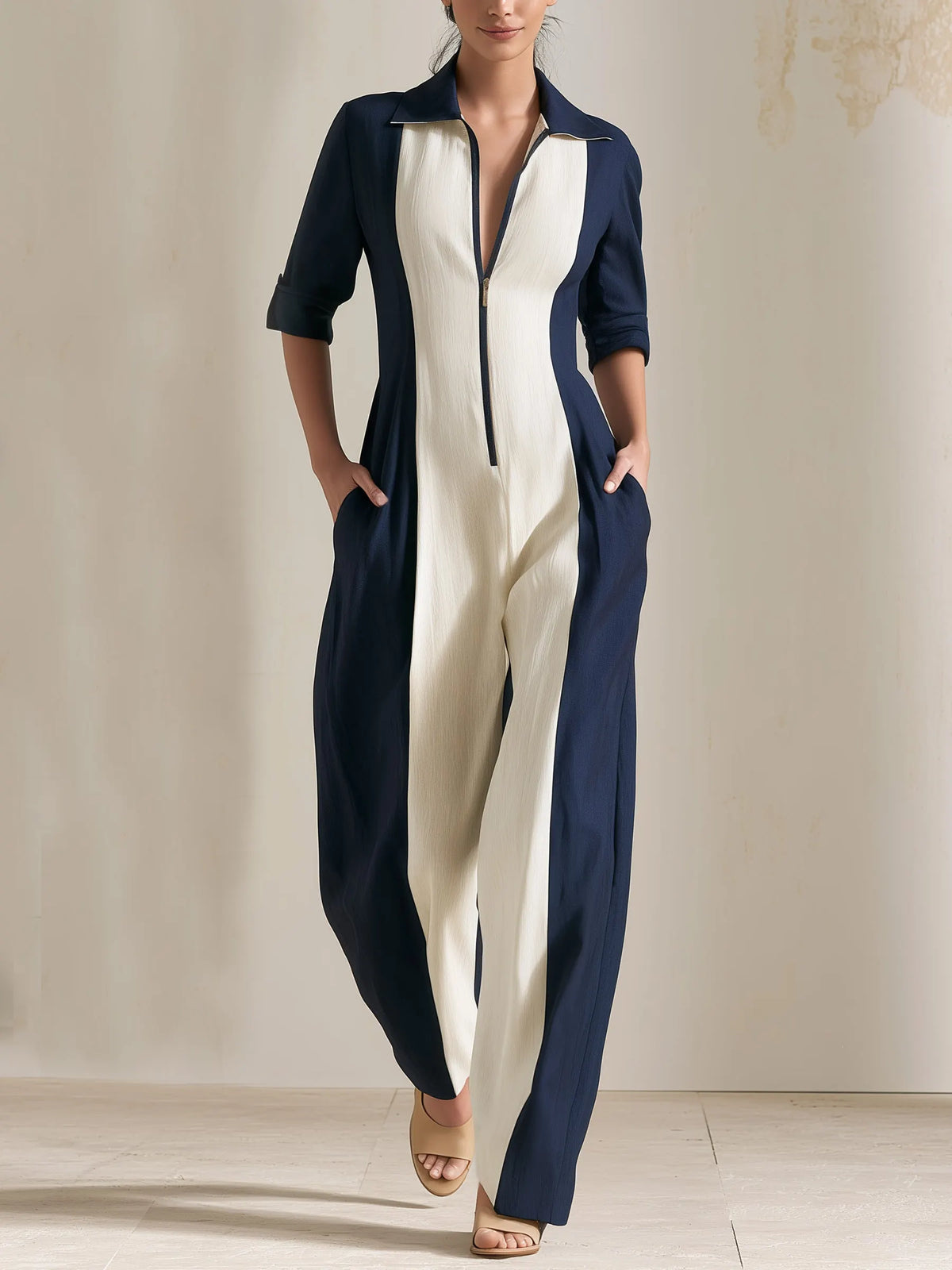 MAGASA - Tuta bicolore blu navy e avorio, maniche lunghe e zip frontale