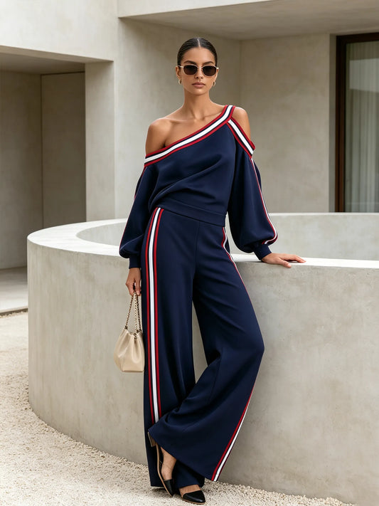 BRITTOLI - Completo blu top asimmetrico e pantaloni palazzo a righe