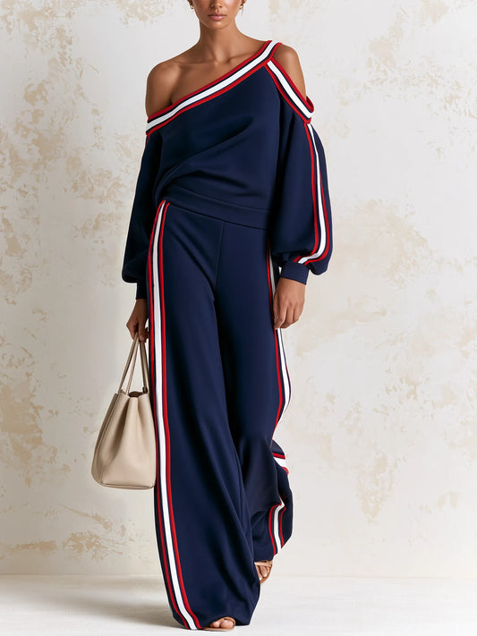 BRITTOLI - Completo blu top asimmetrico e pantaloni palazzo a righe