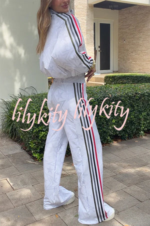 FLAVIA - Giacca sportiva a righe colorblock con stelle e zip collo alto